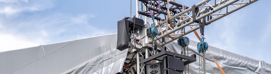 stage lighting and sound equipment on the outdoor stage before a concert